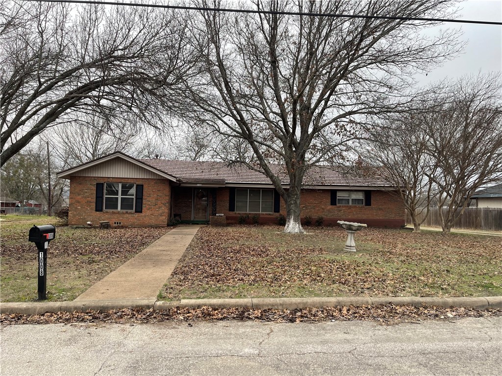 a house with trees in the background