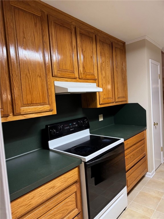 1008 North Bosque Street Meridian, TX 76665 - Photo 23 of 36 a kitchen with granite countertop stainless steel appliances and cabinets