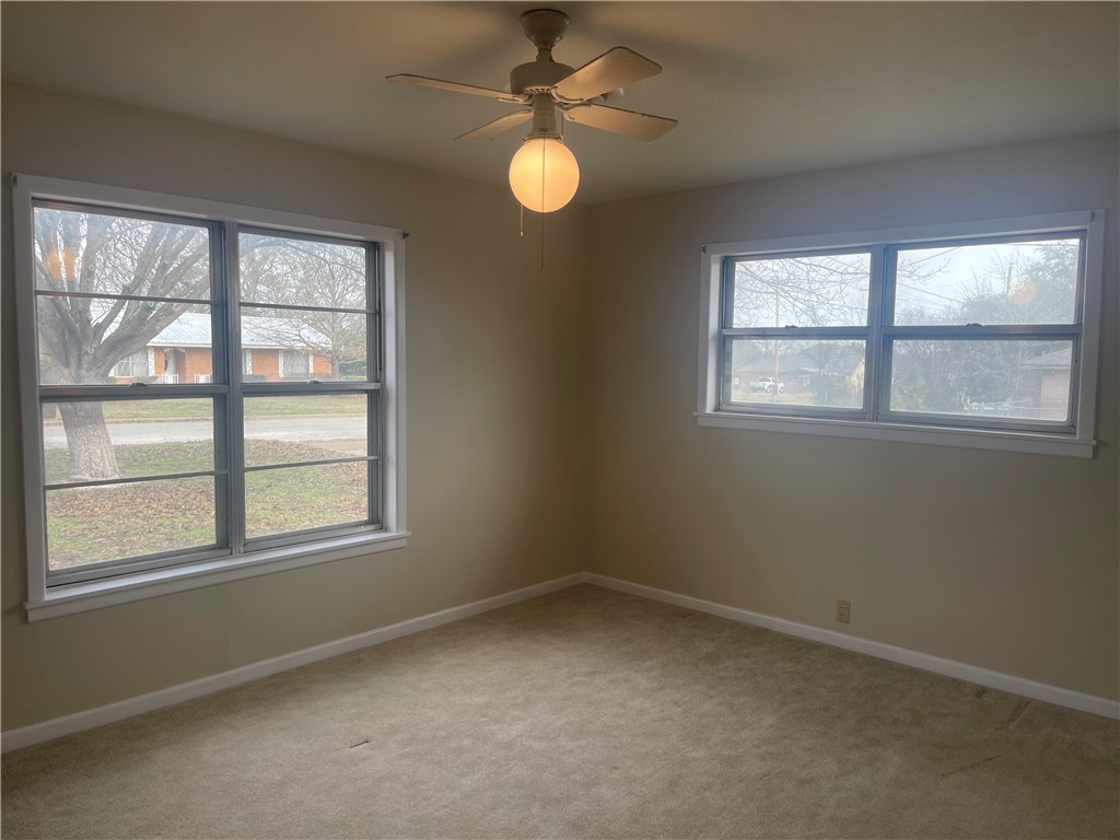 1008 North Bosque Street Meridian, TX 76665 - Photo 24 of 36 an empty room with a window