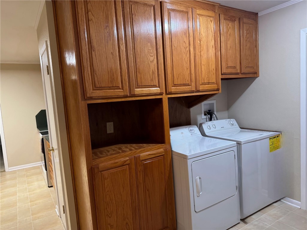 1008 North Bosque Street Meridian, TX 76665 - Photo 28 of 36 a utility room with dryer and washer