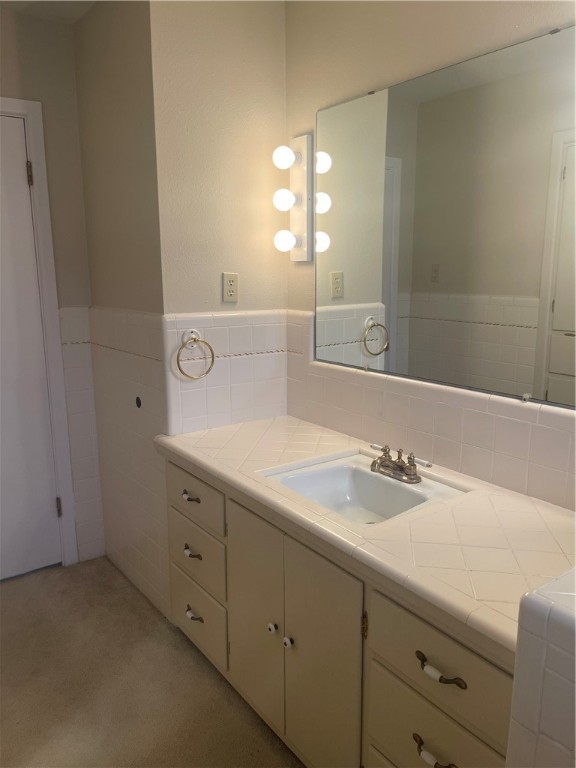 1008 North Bosque Street Meridian, TX 76665 - Photo 3 of 36 a bathroom with a sink and a mirror