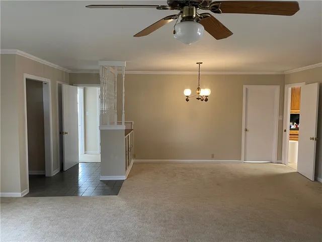 an empty room with a empty space and windows