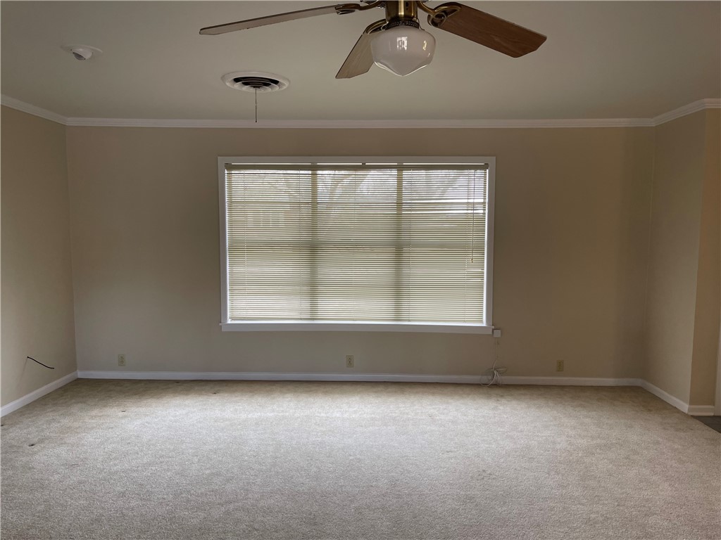 1008 North Bosque Street Meridian, TX 76665 - Photo 10 of 36 an empty room with a empty space and windows