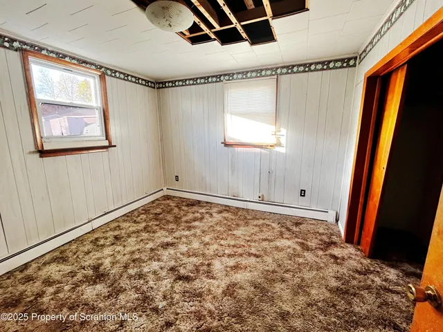 a view of a room with window and gate