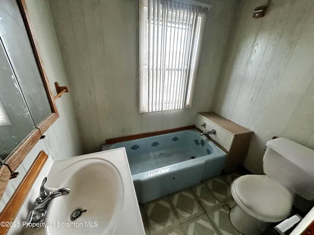 a bathroom with a sink and toilet