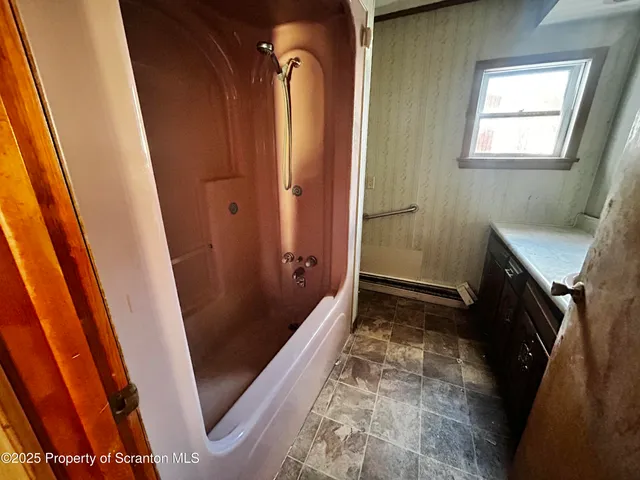 a bathroom with a sink and a shower
