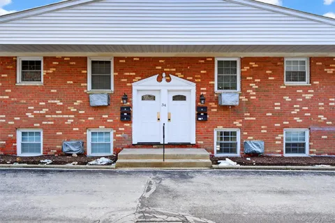 a front view of a building with a street