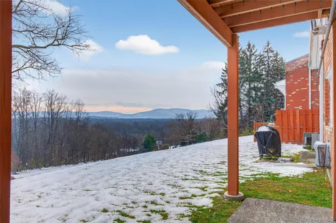 a view of a backyard of the house