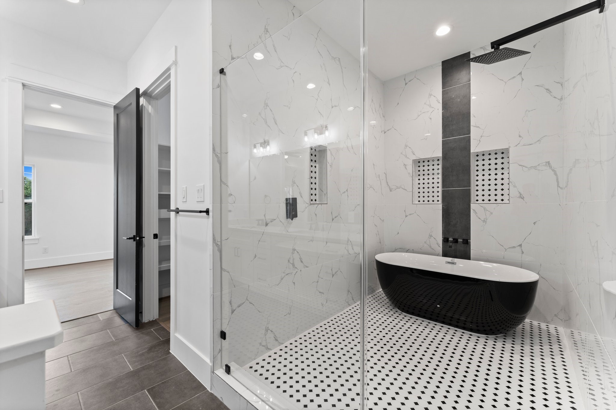 4303 Buck Street Houston, TX 77020 - Photo 24 of 28 Stunning all-inclusive primary shower and freestanding tub area!