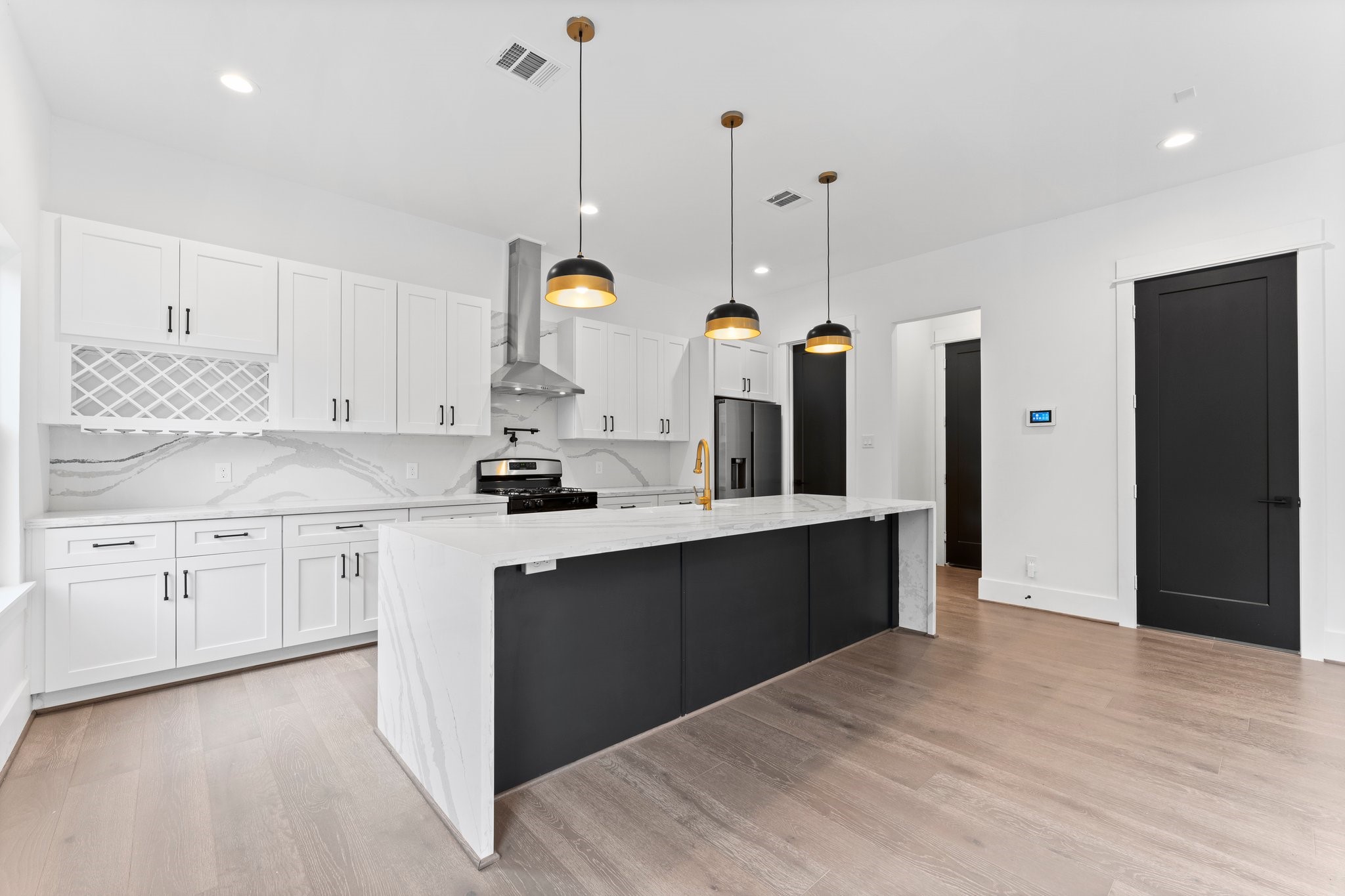 4303 Buck Street Houston, TX 77020 - Photo 10 of 28 Stunning waterfall island with overhang for chairs.