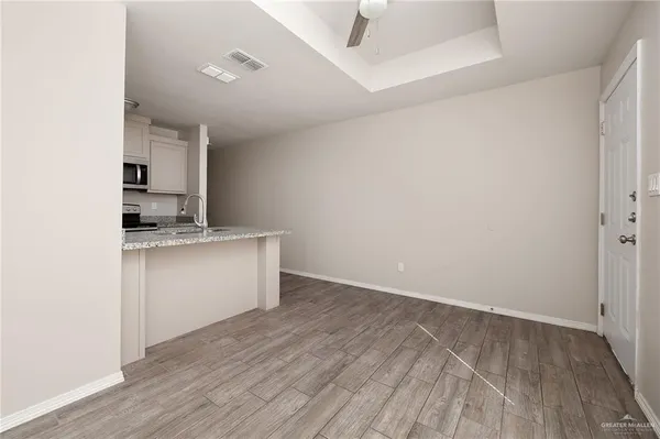 an empty room with wooden floor