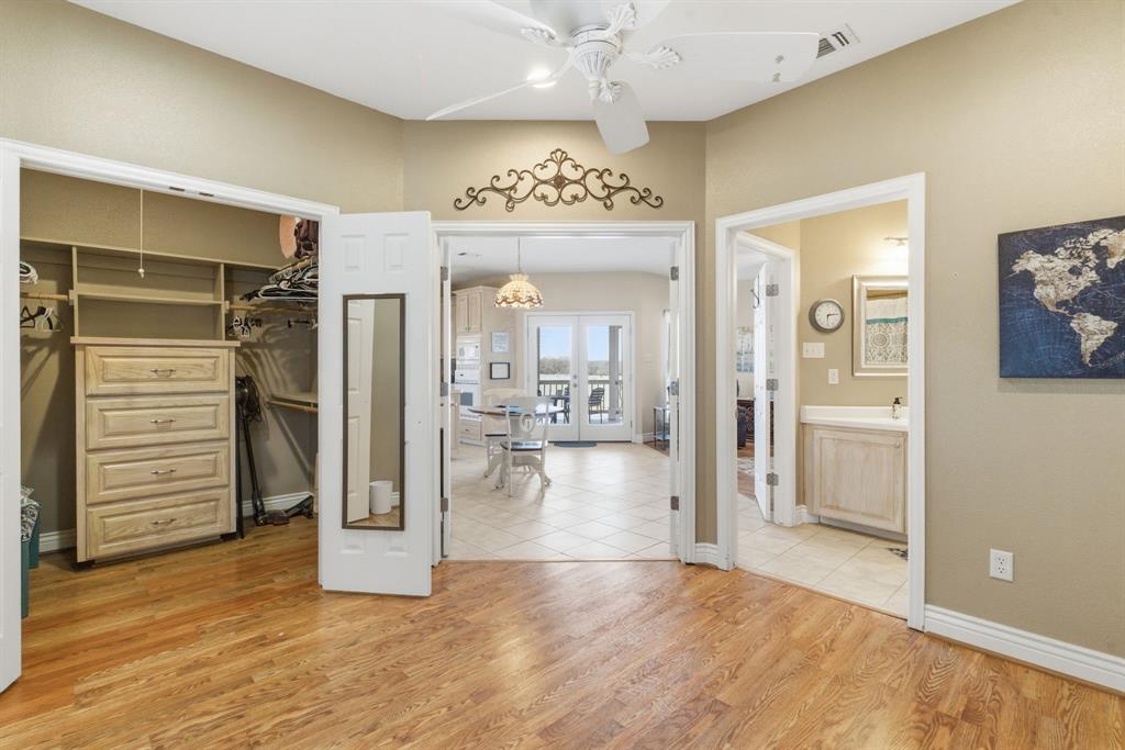 3601 Springfield Road Springtown, TX 76082 - Photo 20 of 40 a view of a hallway view with wooden floor and staircase