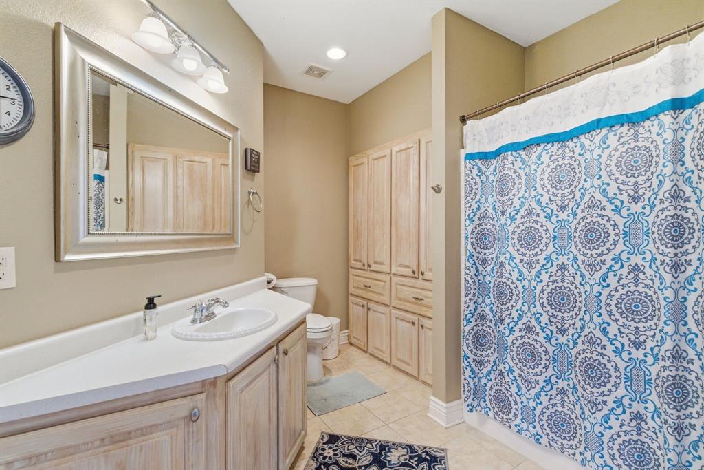 3601 Springfield Road Springtown, TX 76082 - Photo 21 of 40 a bathroom with a sink and a mirror