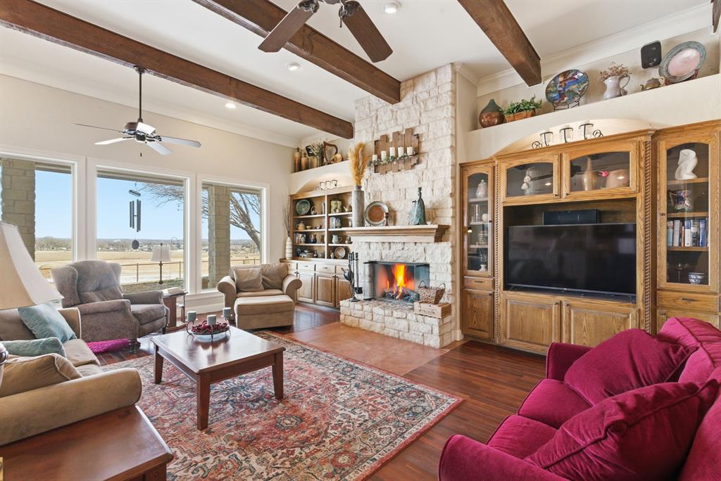 3601 Springfield Road Springtown, TX 76082 - Photo 33 of 40 a living room with furniture and a flat screen tv