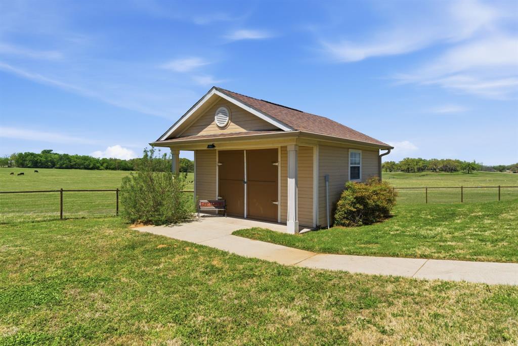 3601 Springfield Road Springtown, TX 76082 - Photo 36 of 40 a front view of a house with a yard