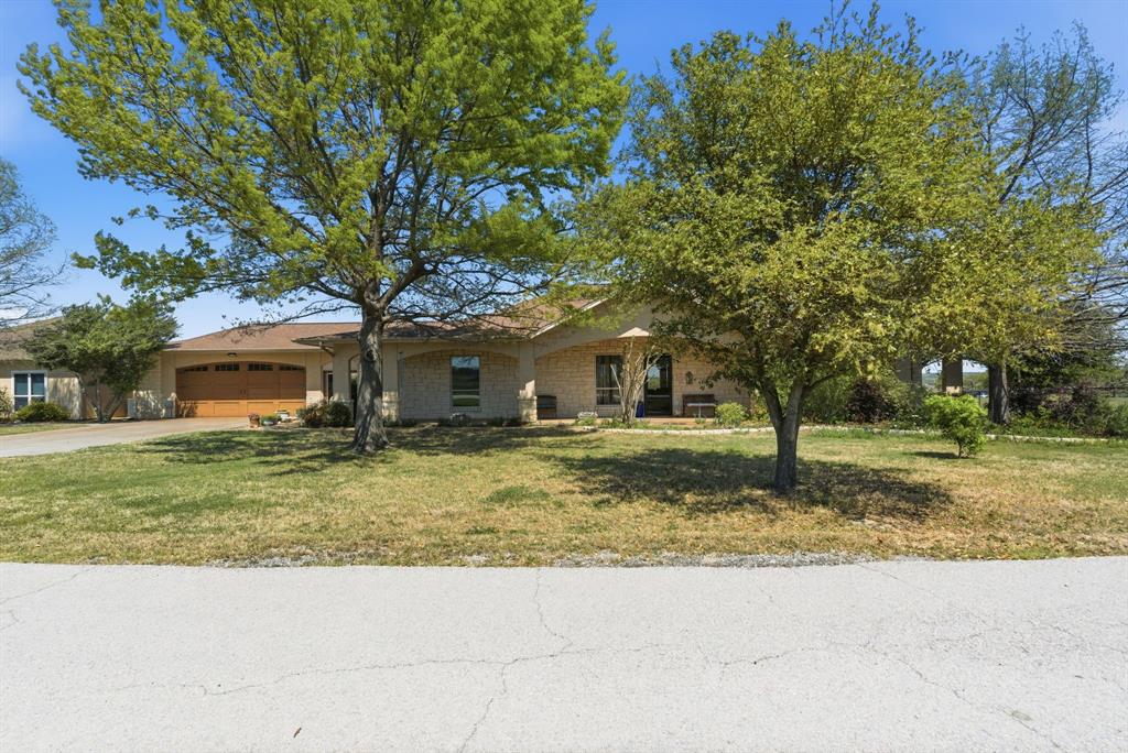 3601 Springfield Road Springtown, TX 76082 - Photo 6 of 40 a view of a house with a yard