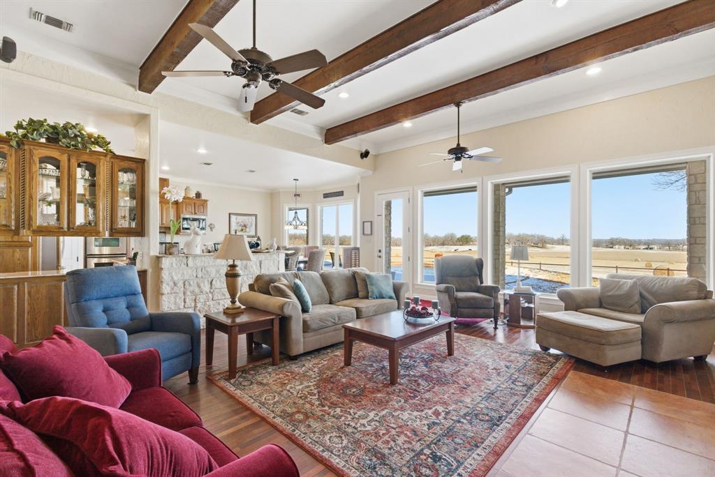 3601 Springfield Road Springtown, TX 76082 - Photo 7 of 40 a living room with furniture ceiling fan and a rug