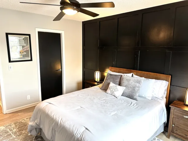 a bedroom with a bed and a walk in closet