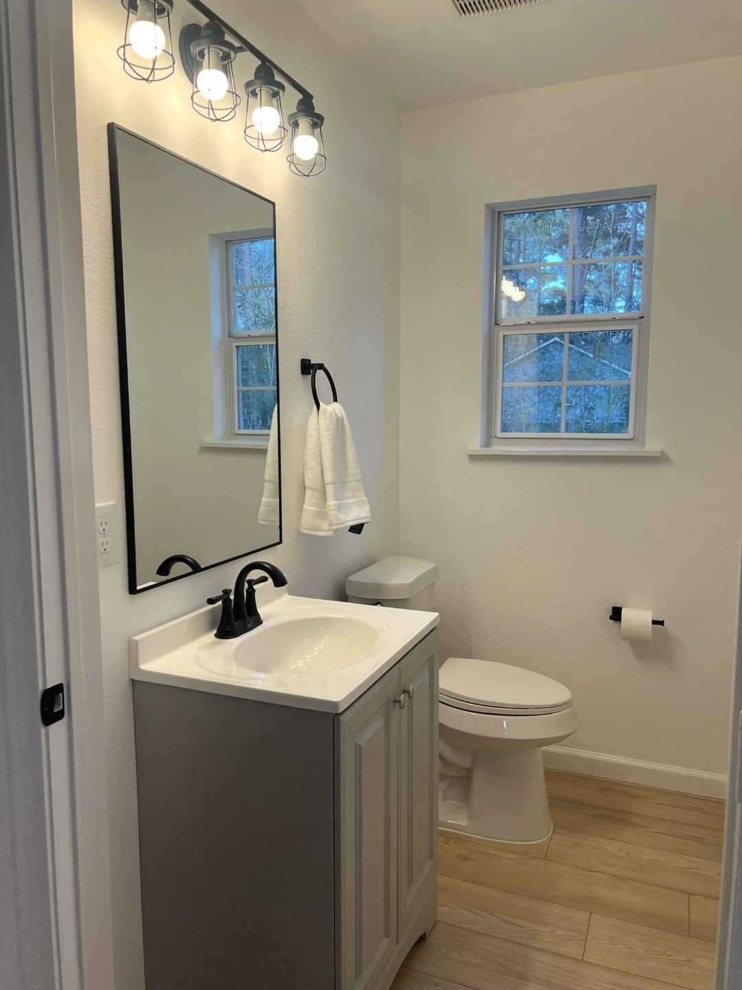 620 St Lawrence River Road Conroe, TX 77316 - Photo 12 of 21 a bathroom with a sink a toilet and mirror
