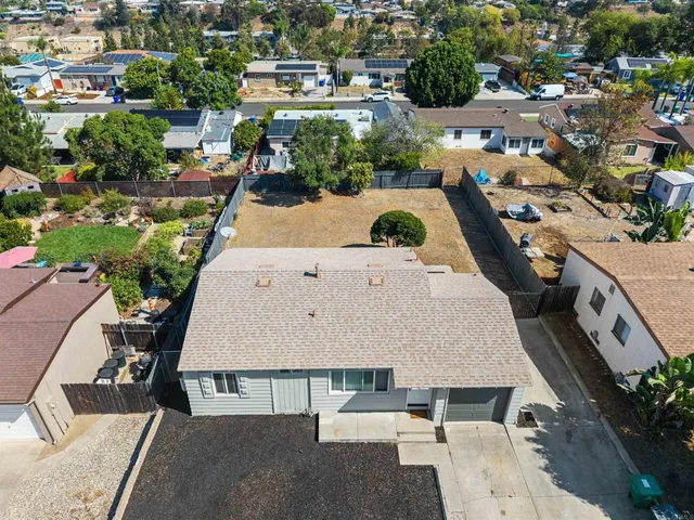 an aerial view of a house with outdoor space