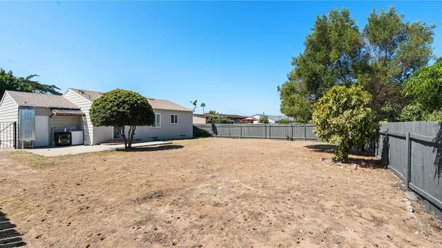a view of a house with a yard and garage