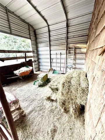 a view of backyard with roof deck