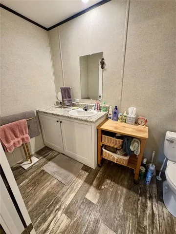 a bedroom with a bed and a table in it