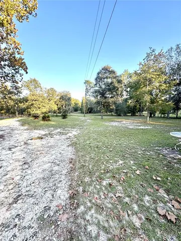 a view of a field with an trees