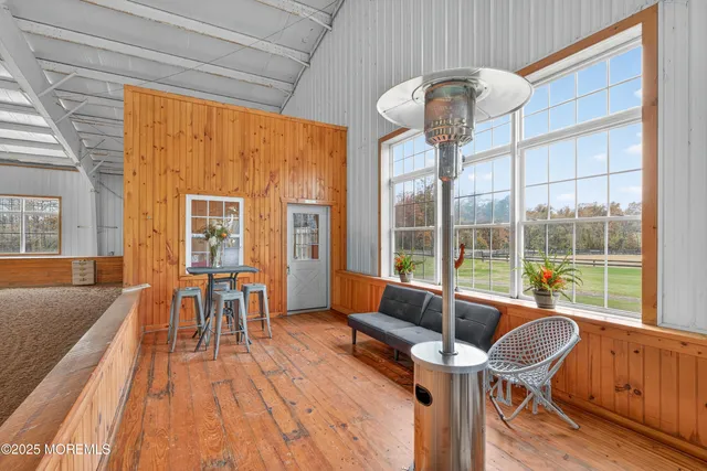 a dining room with furniture and wooden floor
