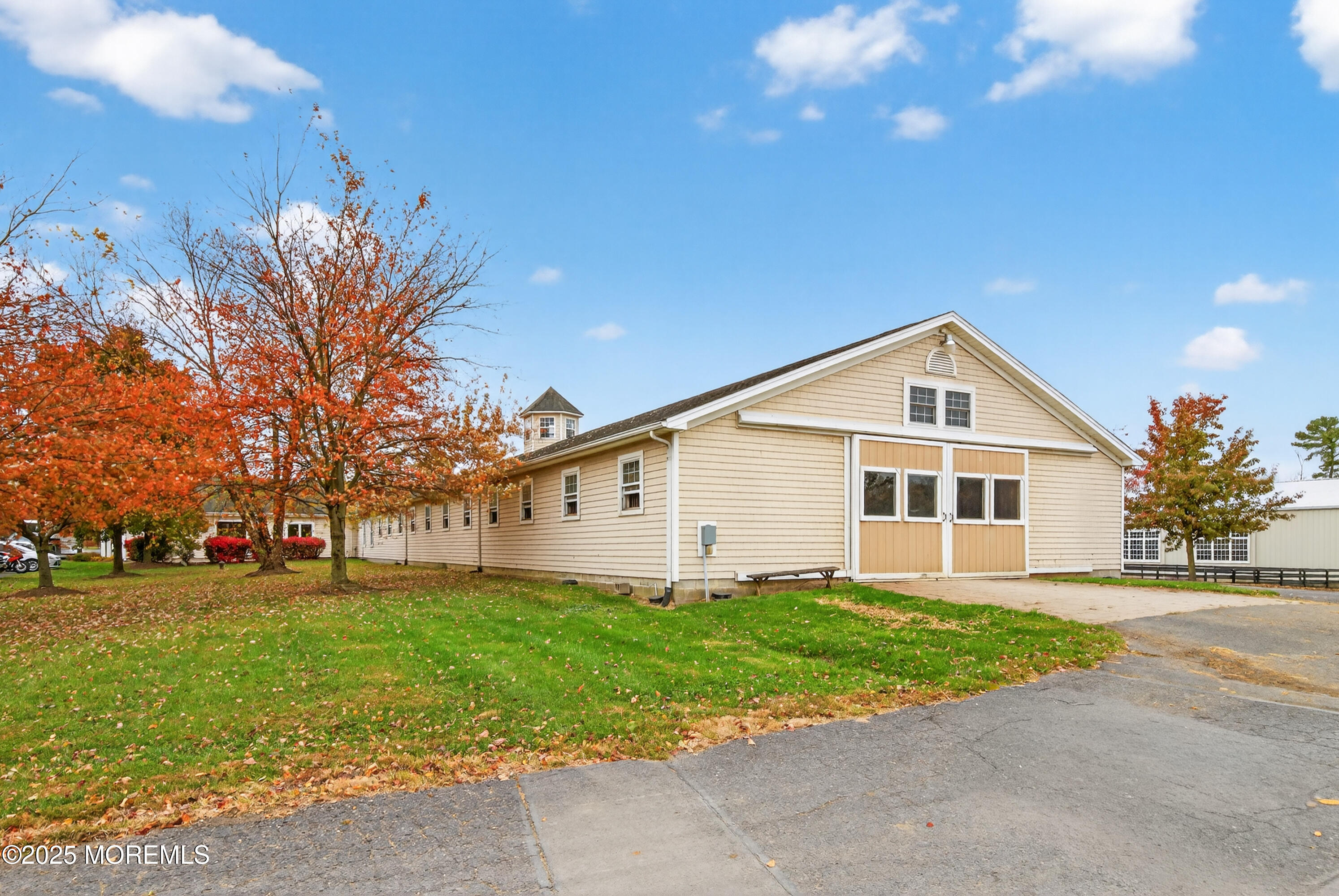 52 Hill Road Allentown, NJ 08501 - Photo 19 of 42 a view of a white house with a big yard and large trees