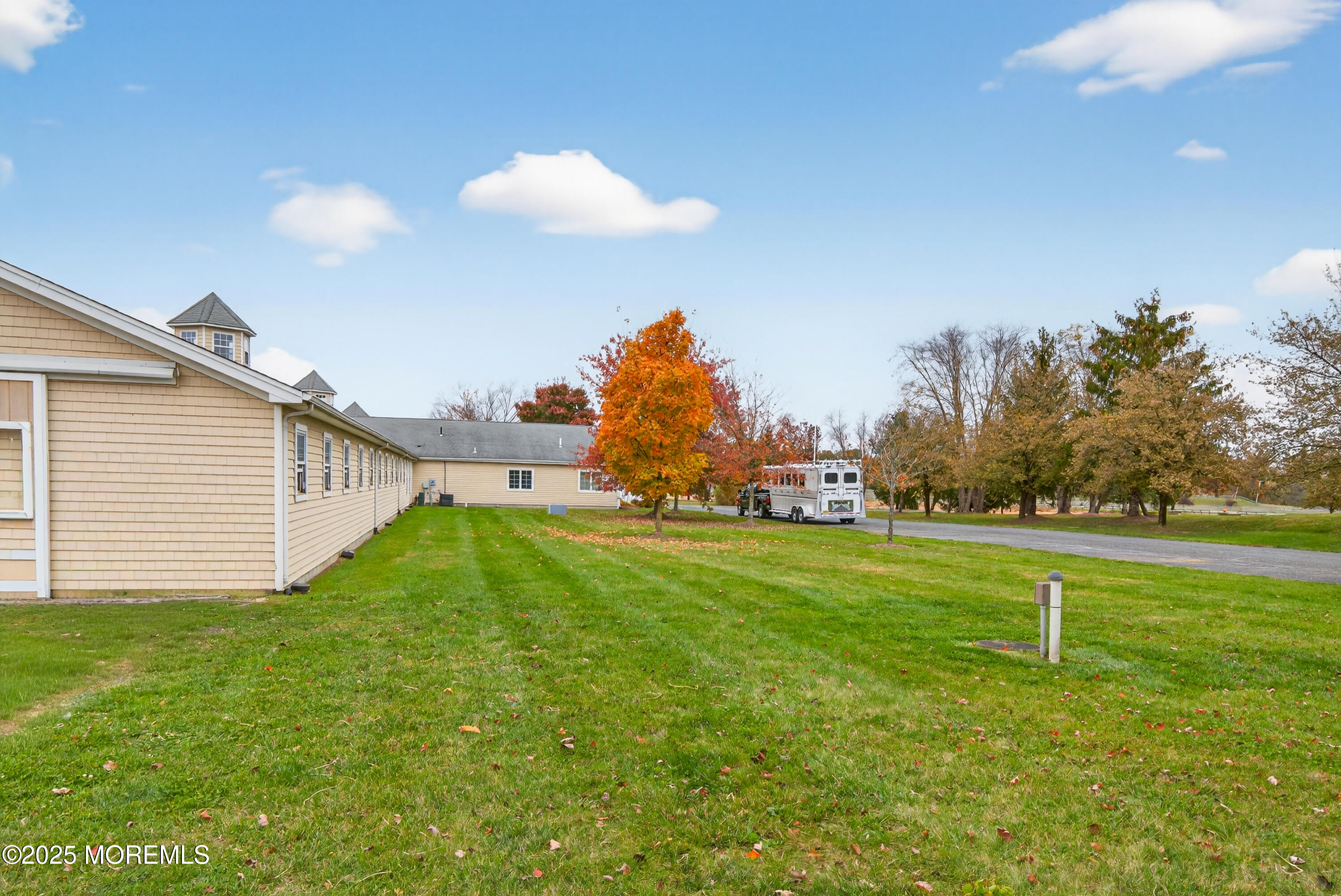52 Hill Road Allentown, NJ 08501 - Photo 22 of 42 a backyard of a house with lots of green space