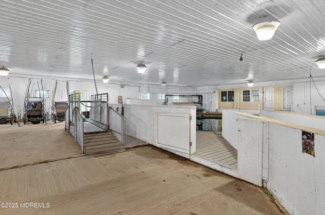 an aerial view of a house with a swimming pool