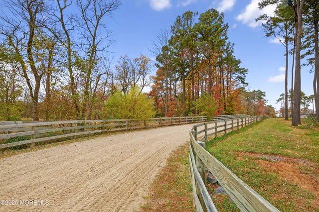 a view of a swimming pool with an outdoor seating and a yard