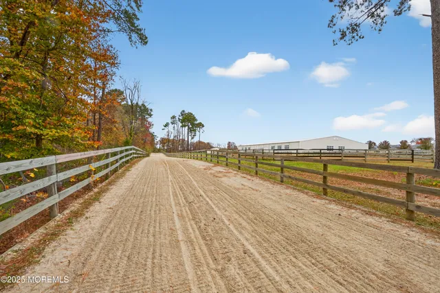 a view of a swimming pool with a lake view