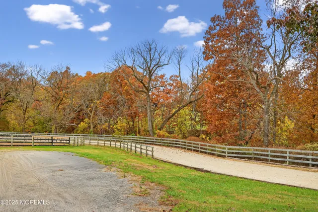 a view of a swimming pool with a lake view