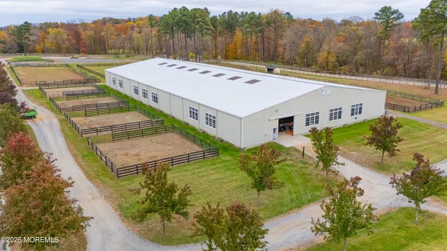 a view of a house with pool and a yard