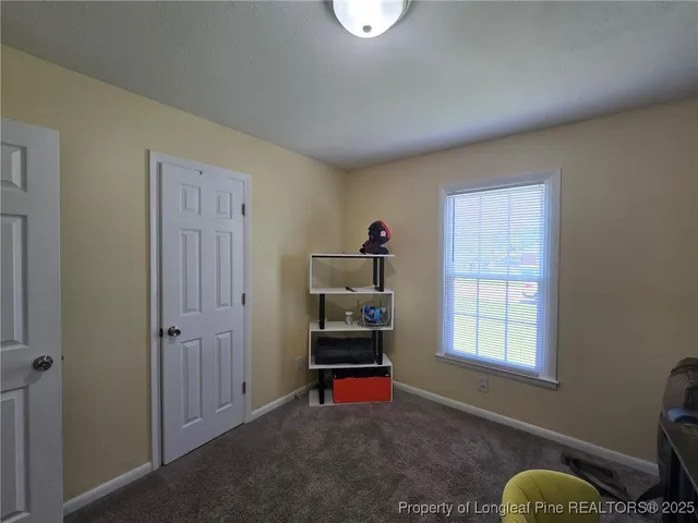 a bedroom with furniture and a window
