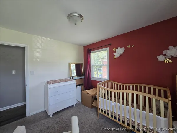 a bathroom with a sink mirror vanity and toilet