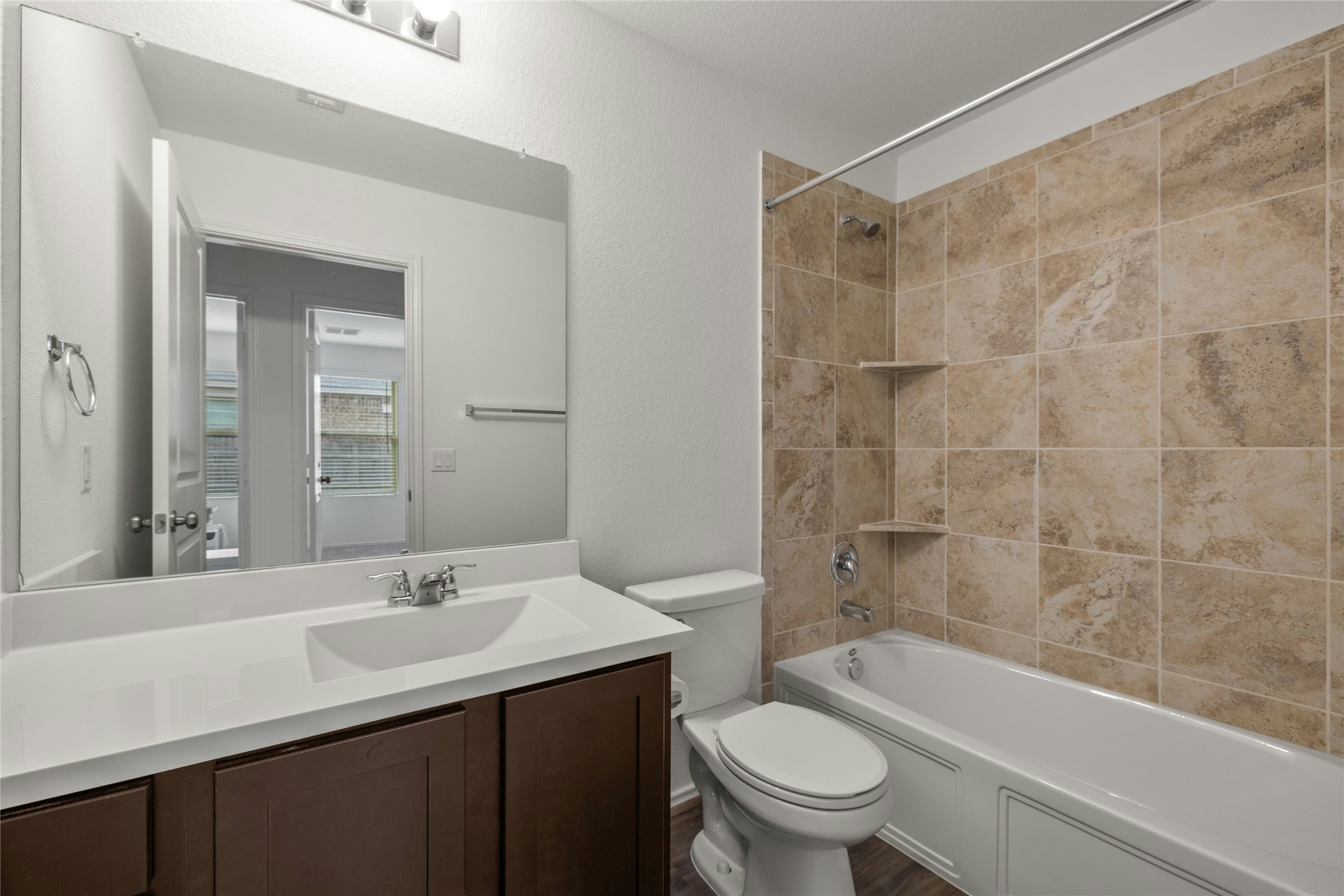 11813 Roscommon Trail Austin, TX 78754 - Photo 23 of 28 a bathroom with a sink a toilet and shower