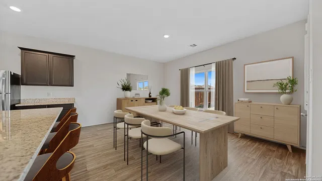 a open kitchen with a table and chairs in it