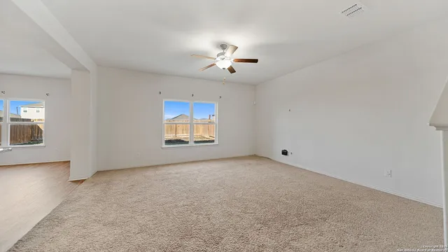 a view of an empty room with a window