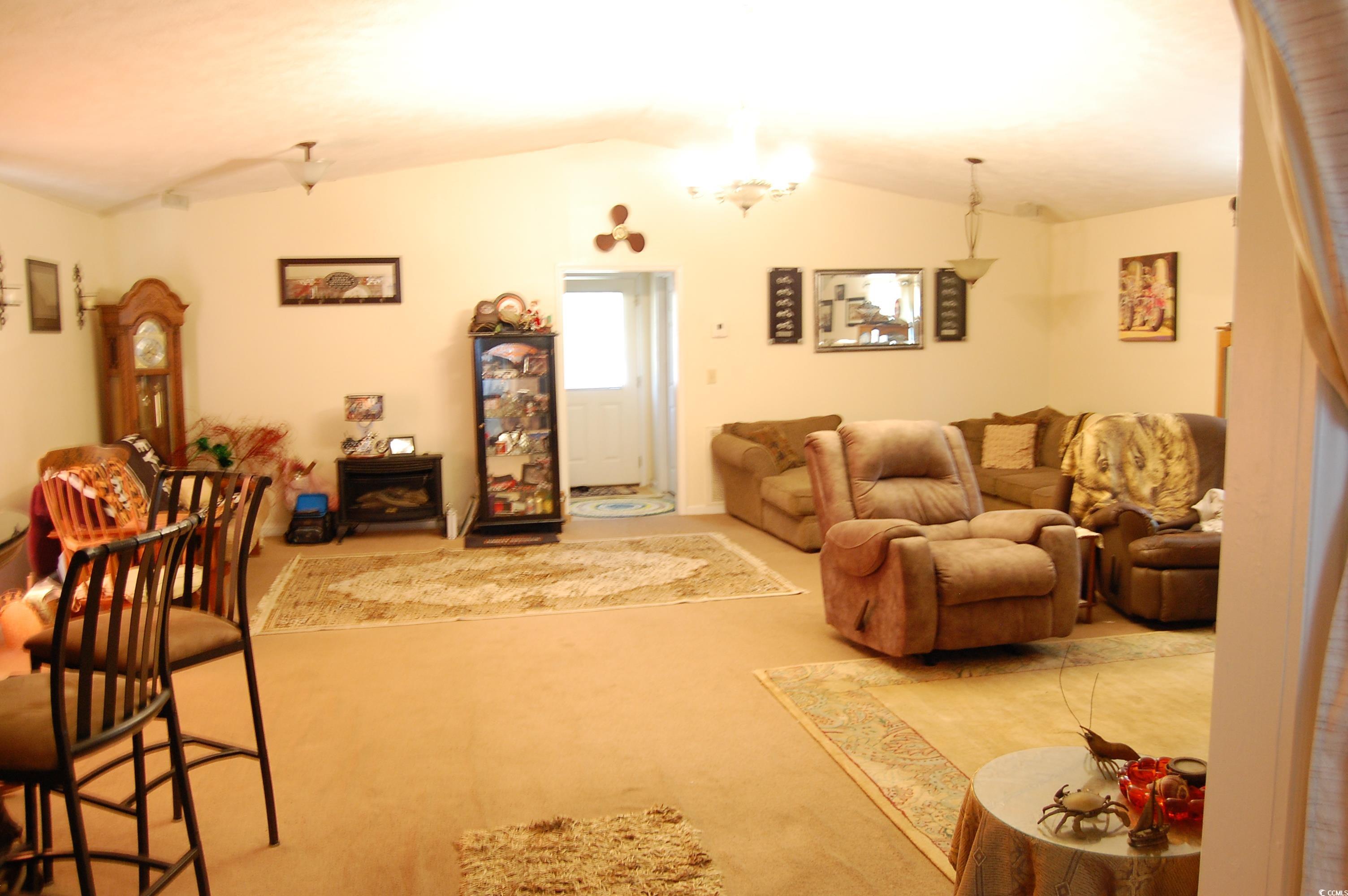 1535 Brick Chimney Road Georgetown, SC 29440 - Photo 10 of 24 Living room with light colored carpet, lofted ceil