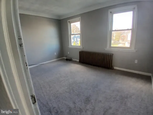 a view of a room with windows