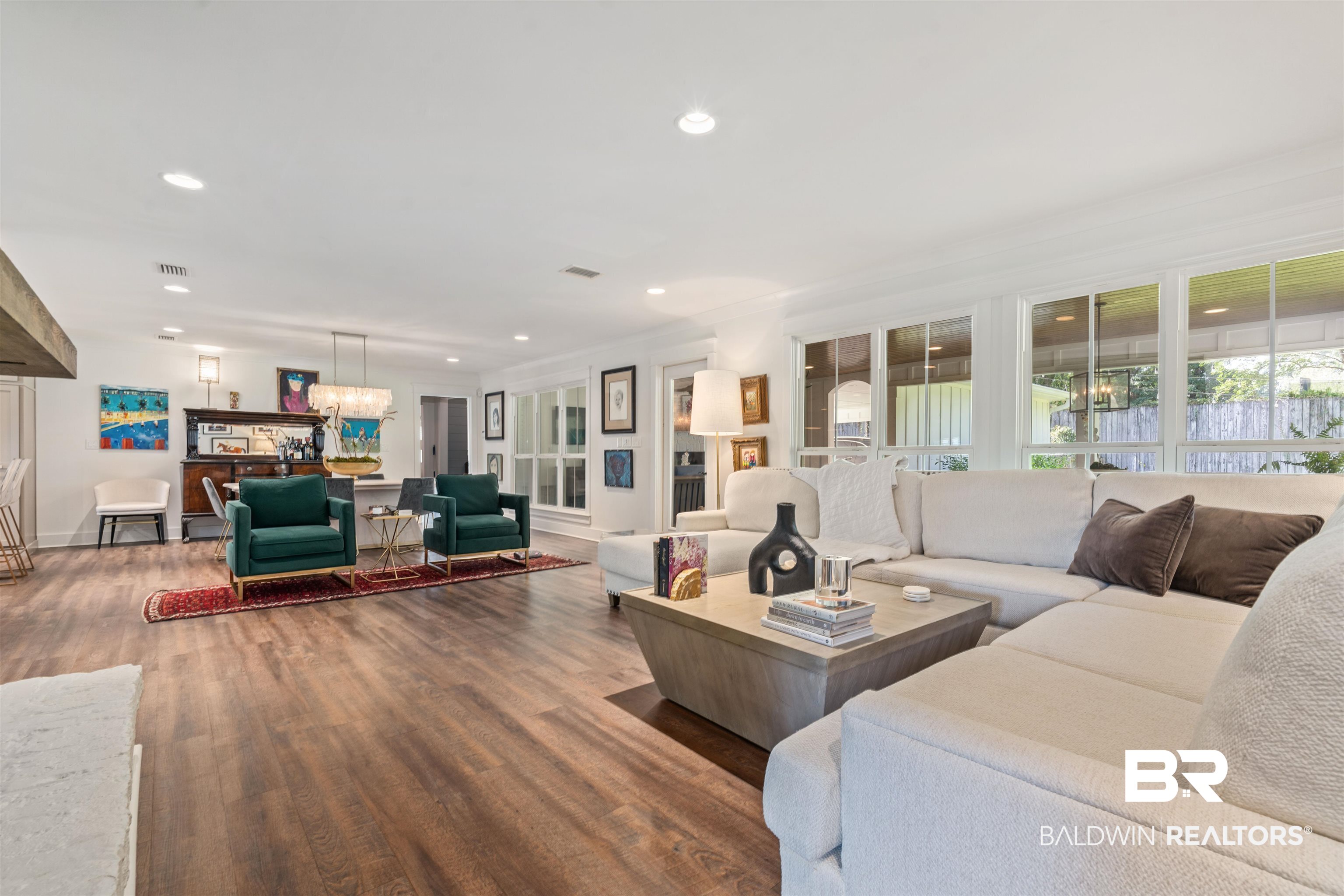 3808 Claridge Road North Mobile, AL 36608 - Photo 8 of 43 Living room featuring hardwood / wood-style flooring, a notable chandelier, and ornamental molding