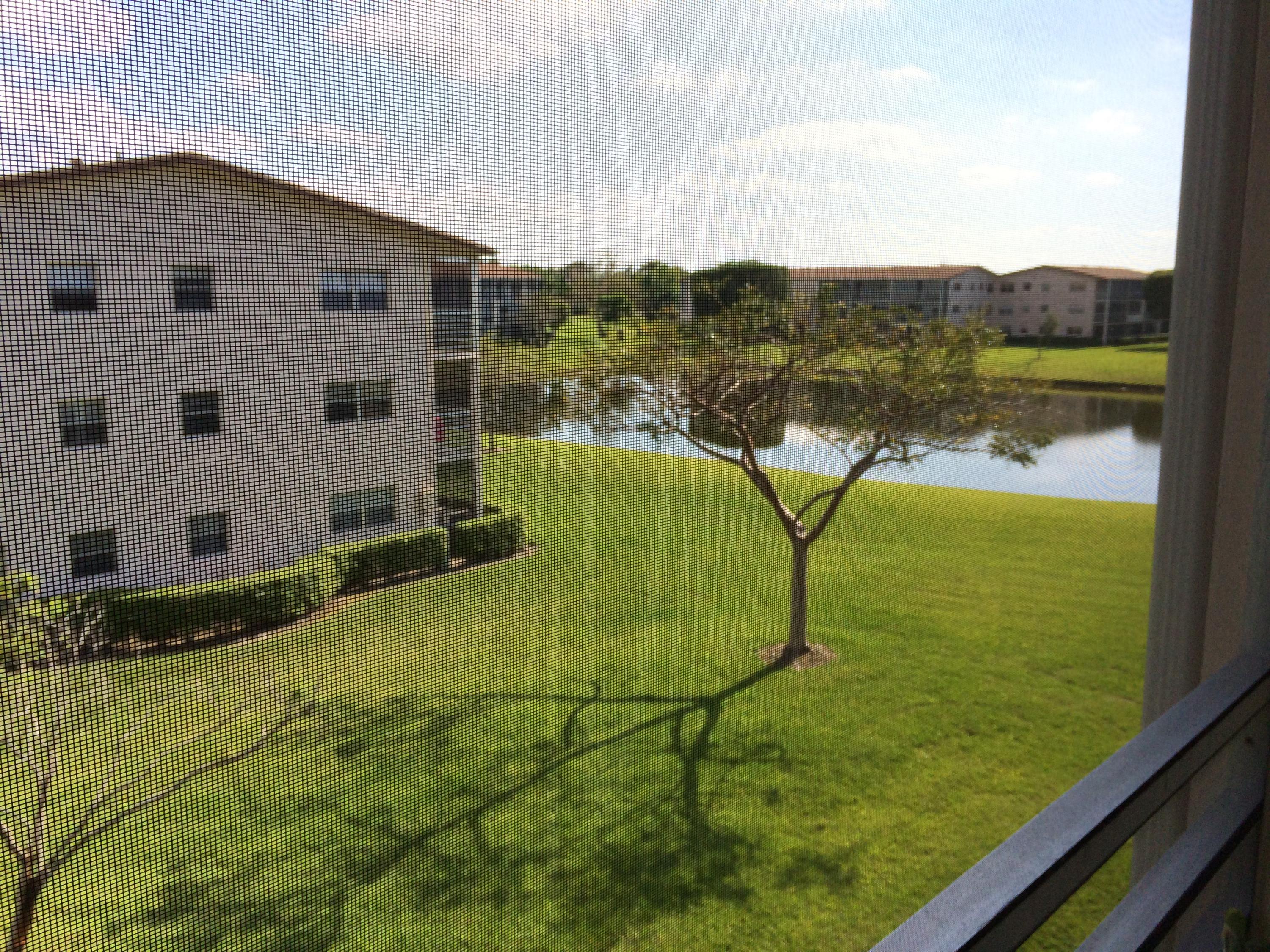 a view of a lake with a yard