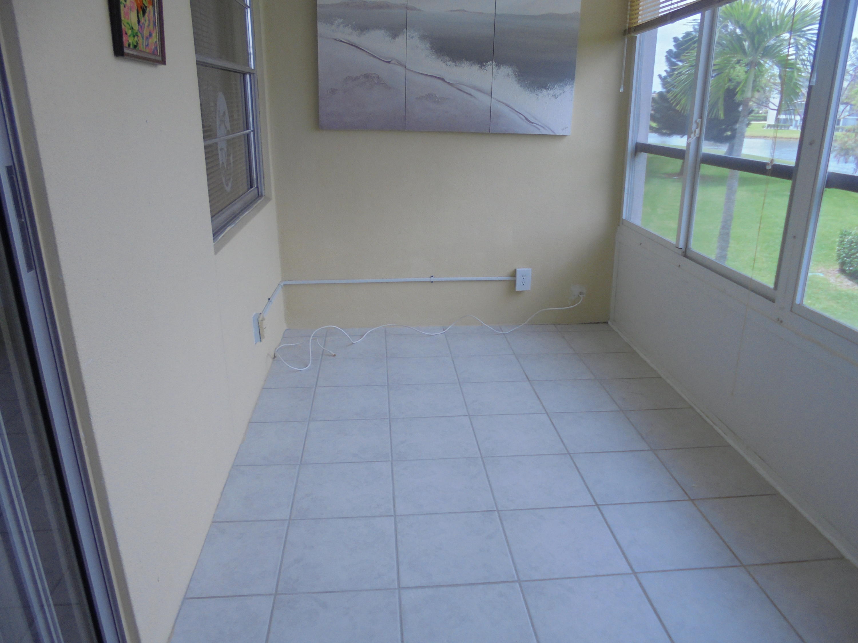 2028 Hythe B Boca Raton, FL 33434 - Photo 12 of 15 a view of an empty room with a window