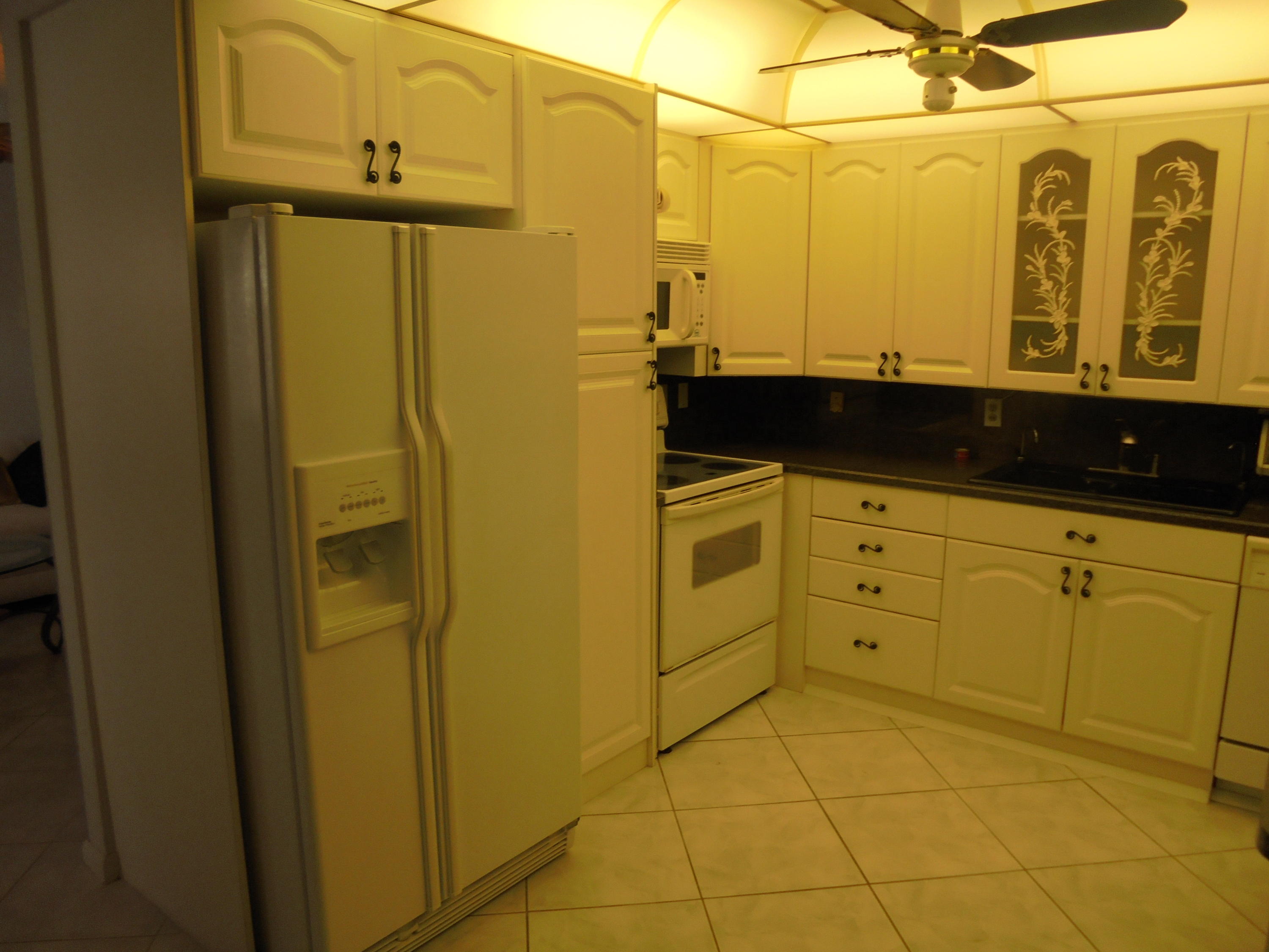 2028 Hythe B Boca Raton, FL 33434 - Photo 3 of 15 a bathroom with a sink and a mirror