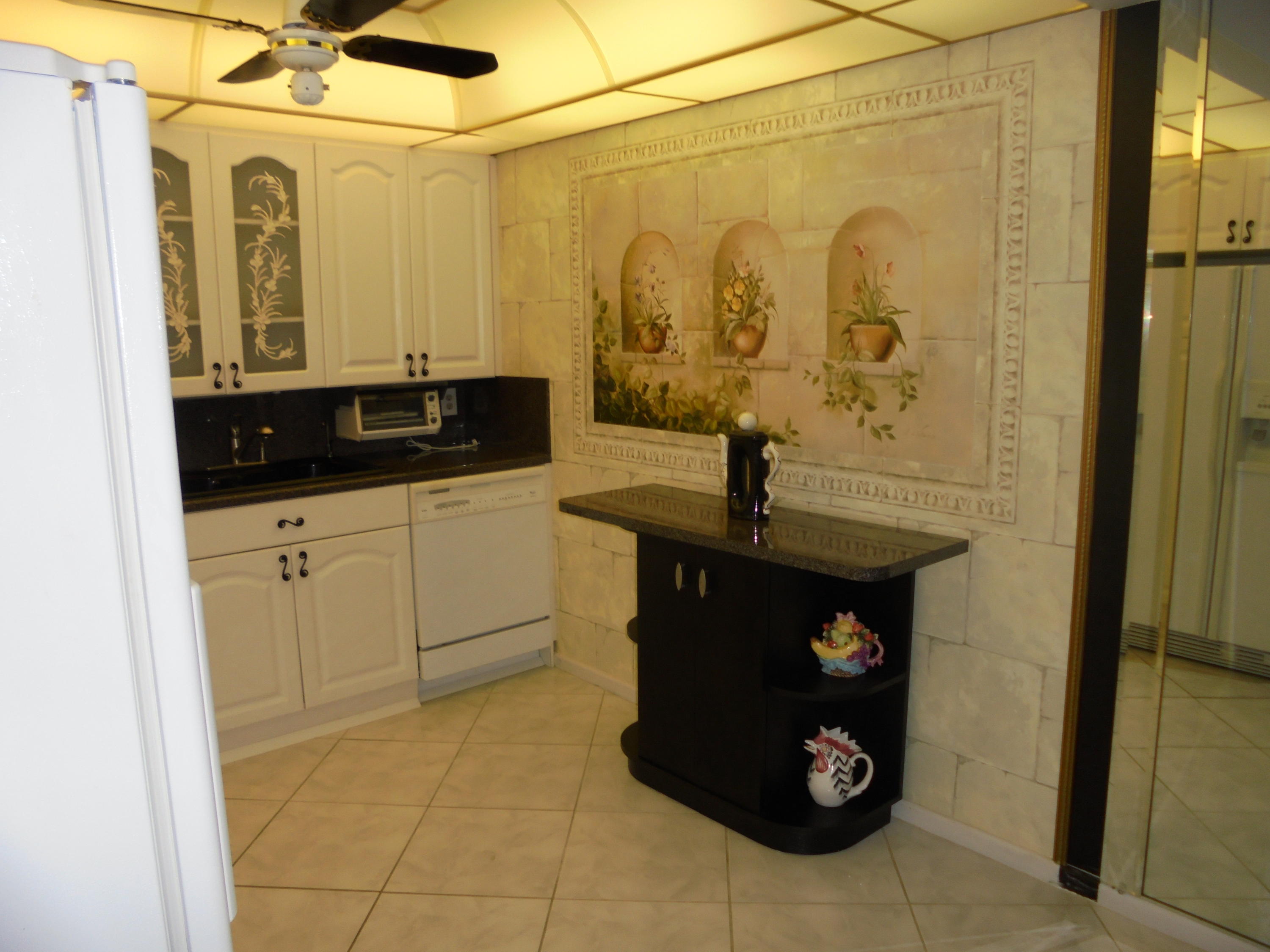 2028 Hythe B Boca Raton, FL 33434 - Photo 4 of 15 a bathroom with a sink and mirror