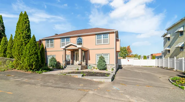 a view of a brick house with a street