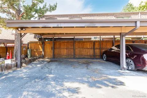 a view of a park with bench and trees